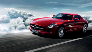 Red Mercedes-Benz SLS AMG on a highway.